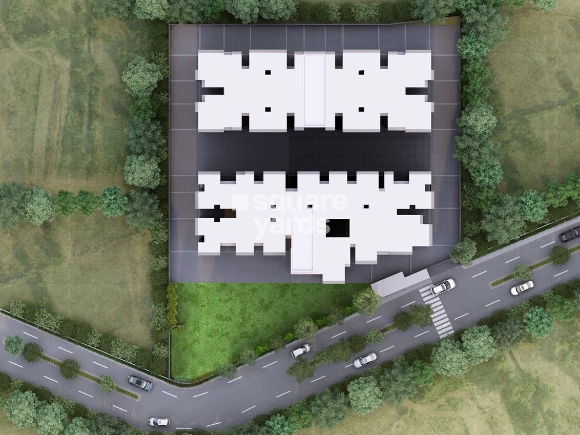 Saanvi-Aarambh_an aerial view of a building with a train on top of it