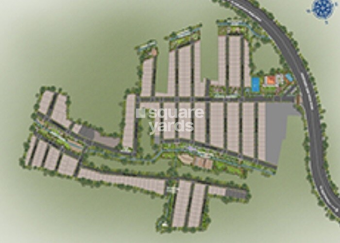 Adarsh-Garden-Estate_an aerial view of a city with a train on it