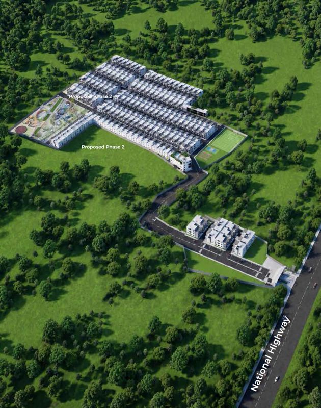 Daiwik-Sayuri_an aerial view of a large field with a large building