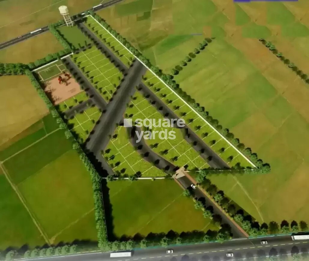 Ikya-Bharthi-Vihar_an aerial view of a grassy field with a train on it