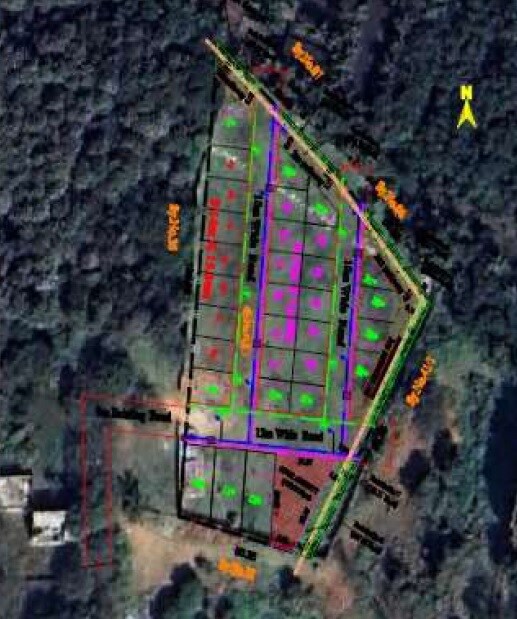 Jyothi-Anu-Greens_an aerial view of a building with graffiti on it