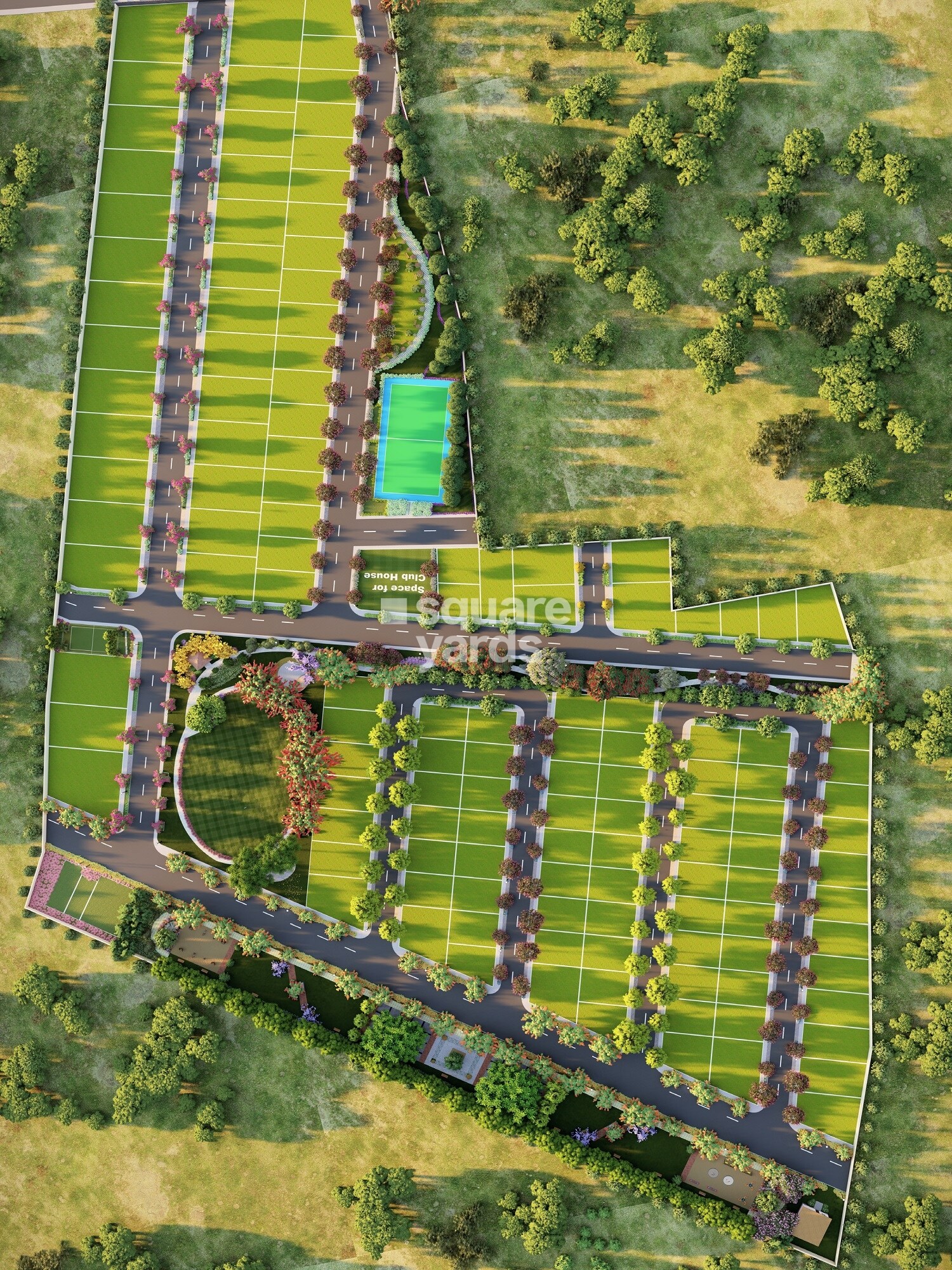 Shrinika-Homes-Plot_an aerial view of a green field with a train on it