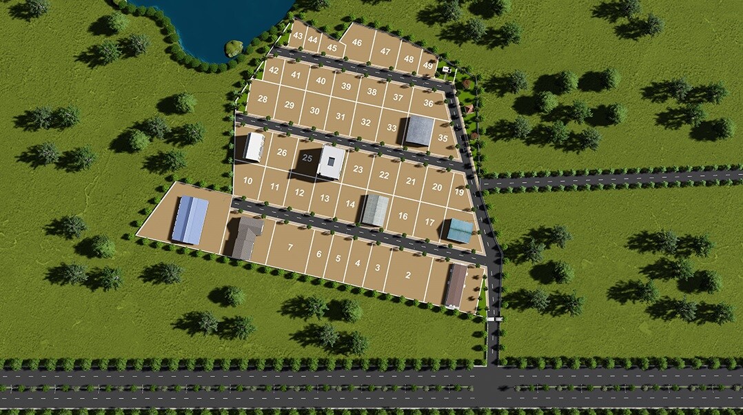 Vaishnodevi-Industrial-Estate_a large green field with trees and houses