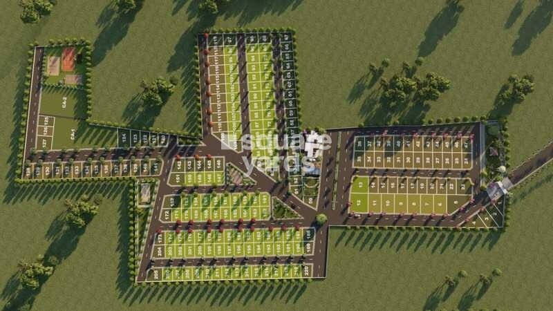 VSL-Srinidhi-Greenage_an aerial view of a green field with a train on it