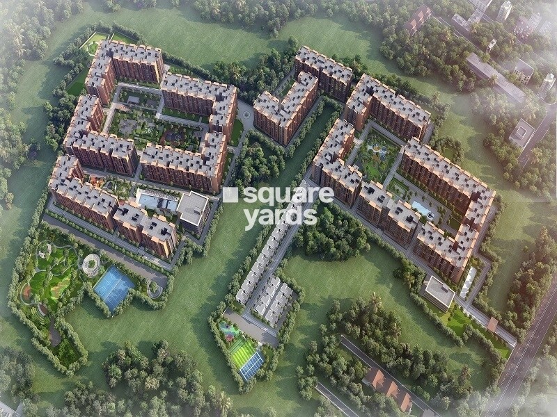 Casagrand-Hola_an aerial view of a large field with houses and trees
