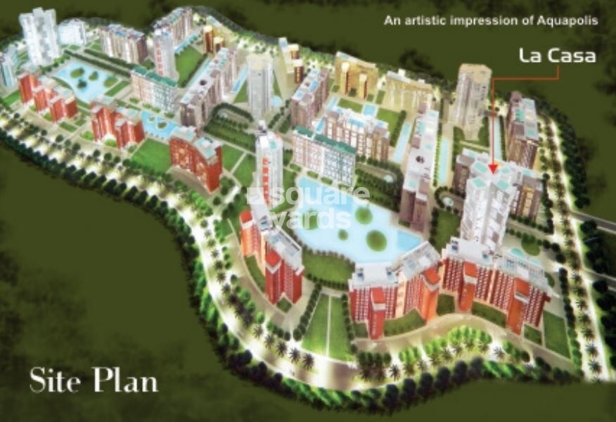 Adwik-Group-La-Casa_a model of a train on top of a lush green field