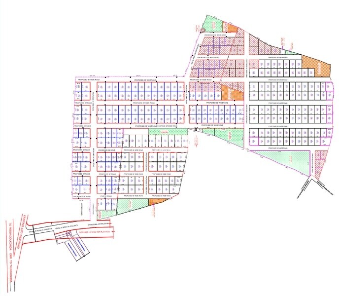 Pavan-Green-Aero-View_an aerial view of a building with a kite flying in the air