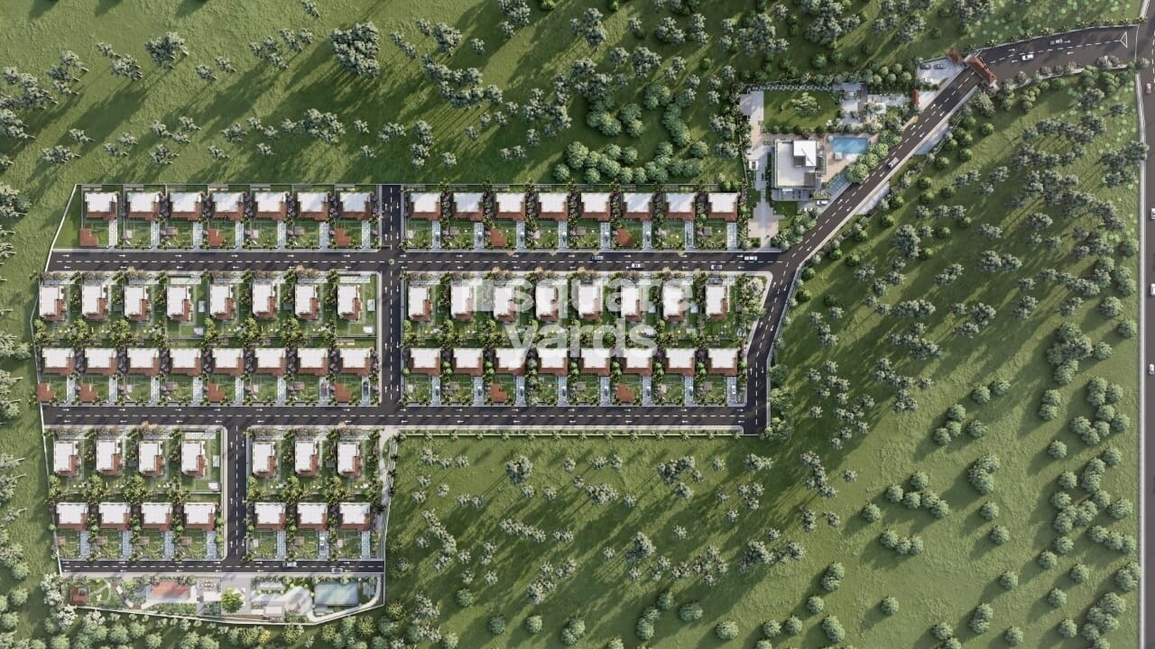 Vijetha-The-Otherside_an aerial view of a small town with a large building
