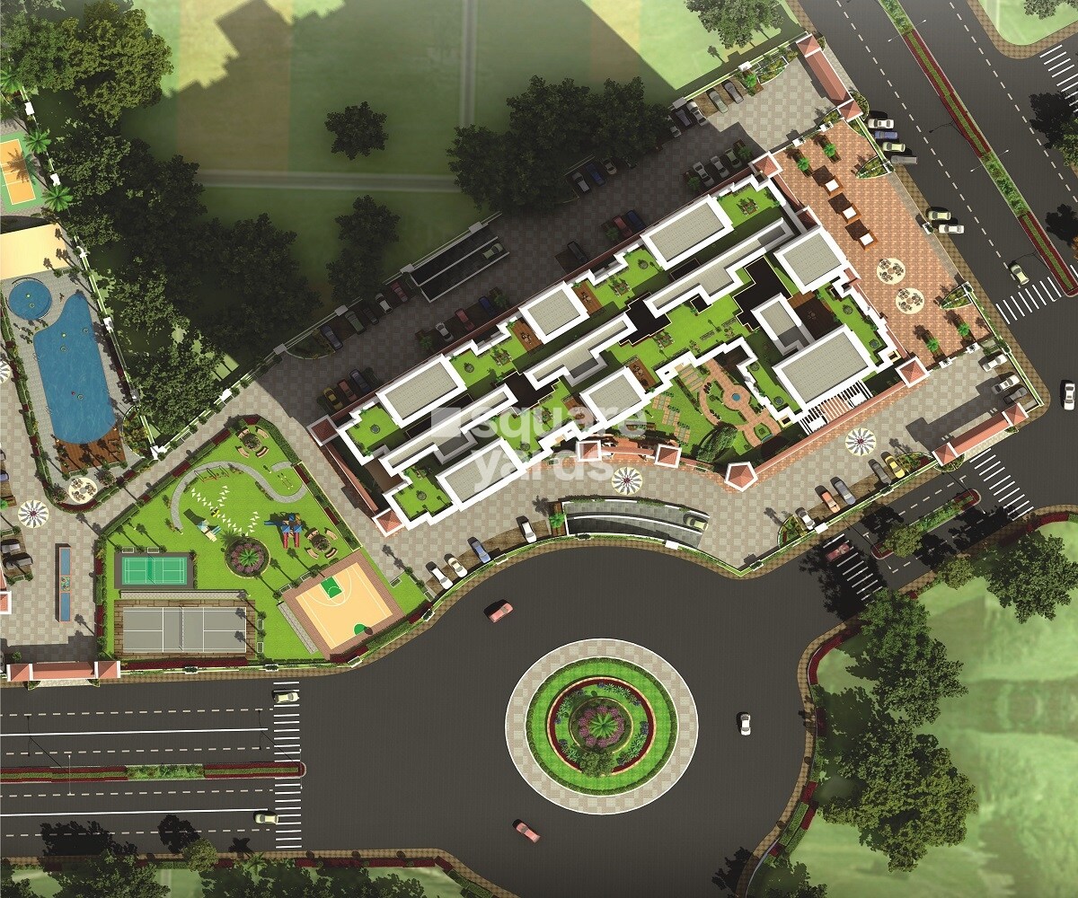 Apeksha-Jai-Vilas_an aerial view of a city with lots of green grass