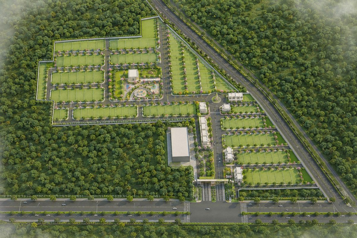 Manglam-Anand-Bagh-Kotputli_an aerial view of a green field with a train on it