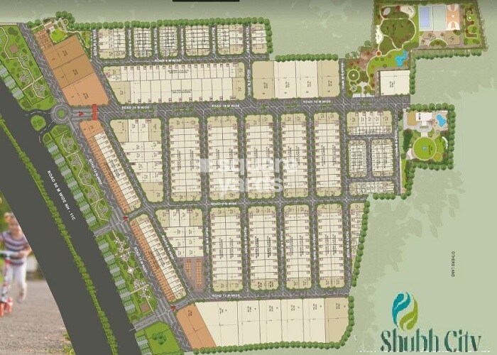 Shubham-Shubh-City_an aerial view of a city with a train on the tracks