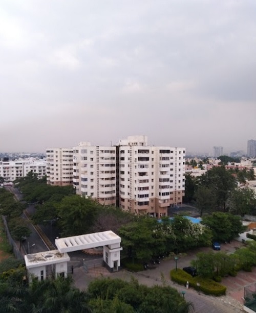 Anand Nagar_a large building with a lot of trees