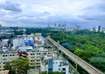 Ashok Nagar_a cityscape of a city with a train going by