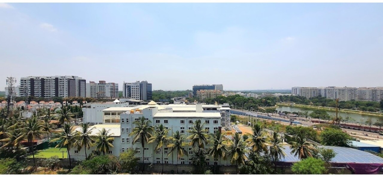 Bellandur_a large building with a large clock on it