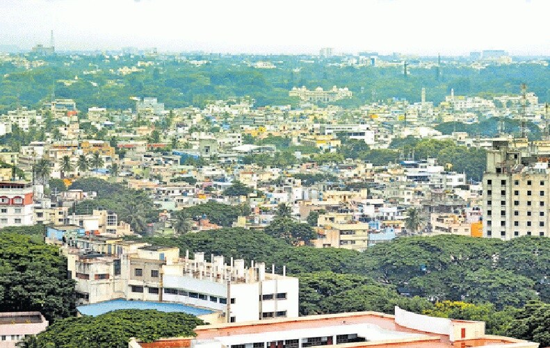 Bidadi_a city with tall buildings and a sky background