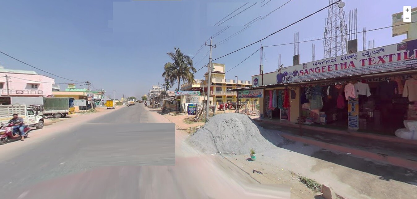 Chikka Tirupathi_a street filled with lots of cars and buildings