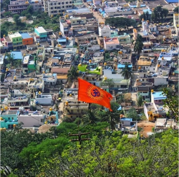 Chintamani_a colorful kite flying over a city street