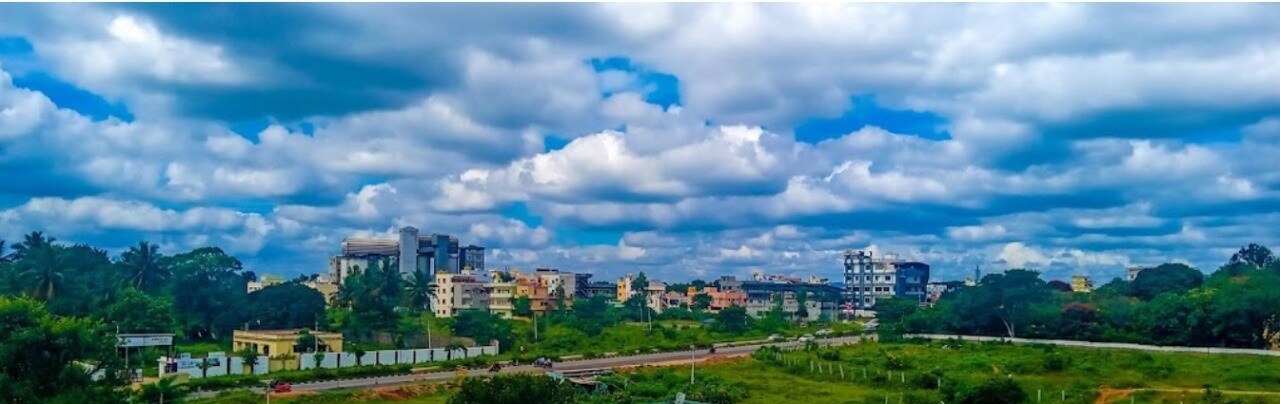 Doddaballapura_a cityscape of a city with tall buildings