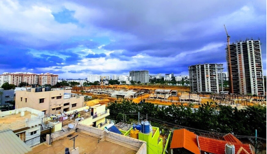 Hoodi_a cityscape of a city with buildings