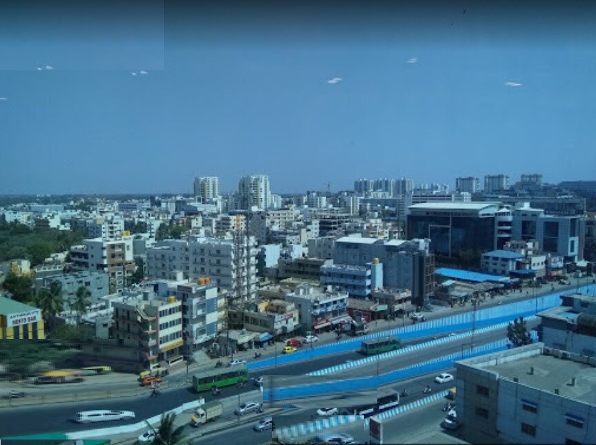 Kadubeesanahalli_a city at night with a large building