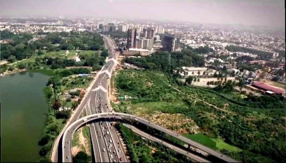 Maruthi Nagar_a train crossing a bridge over a river