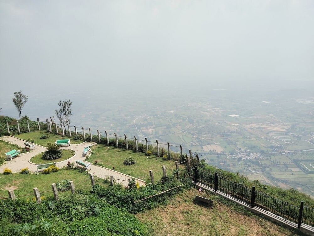 Nandi Hills_a grassy area with a fence and trees