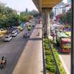 Rajaji Nagar_a street filled with lots of cars and motorcycles