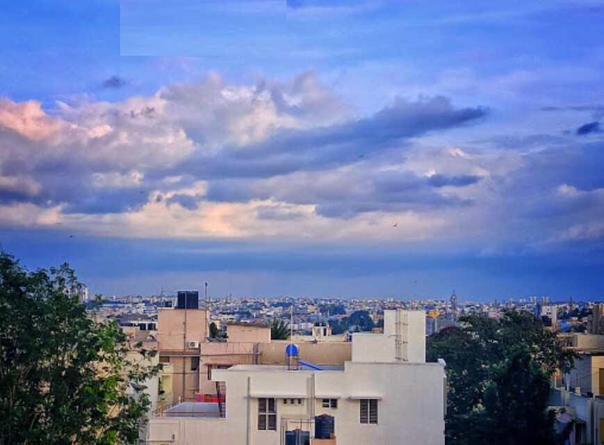 RT Nagar_a city skyline with a sky background