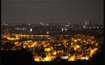 Yelahanka New Town_a city at night with lots of tall buildings