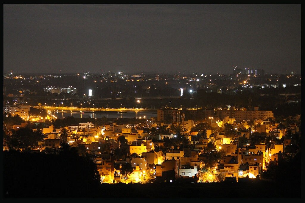 Yelahanka New Town_a city at night with lots of tall buildings