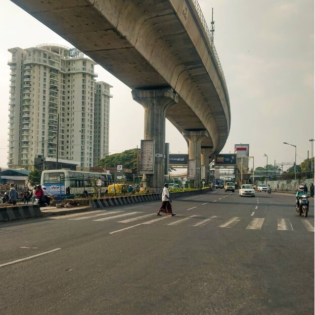 Yeshwanthpur_a train crossing a bridge over a city street