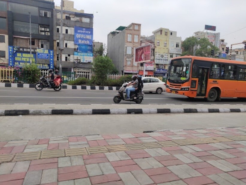 Adarsh Nagar_two busses are parked on the side of the road