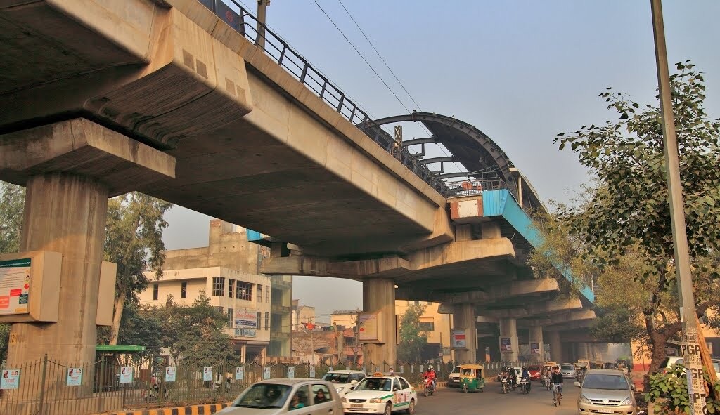 Ashok Nagar_a train crossing a bridge over a river