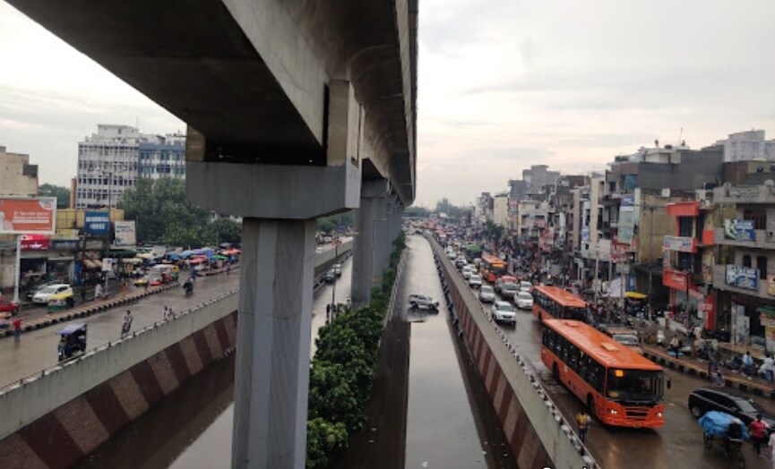 Azadpur_a train crossing a bridge over a city street