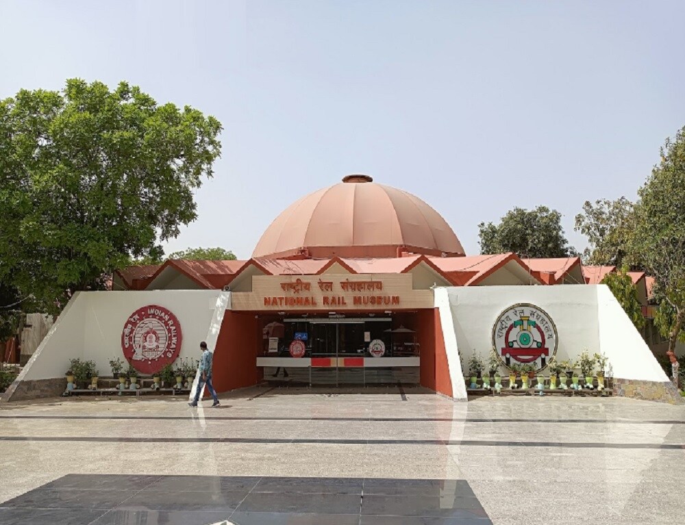 Chanakyapuri_a large red and white tent sitting under a building