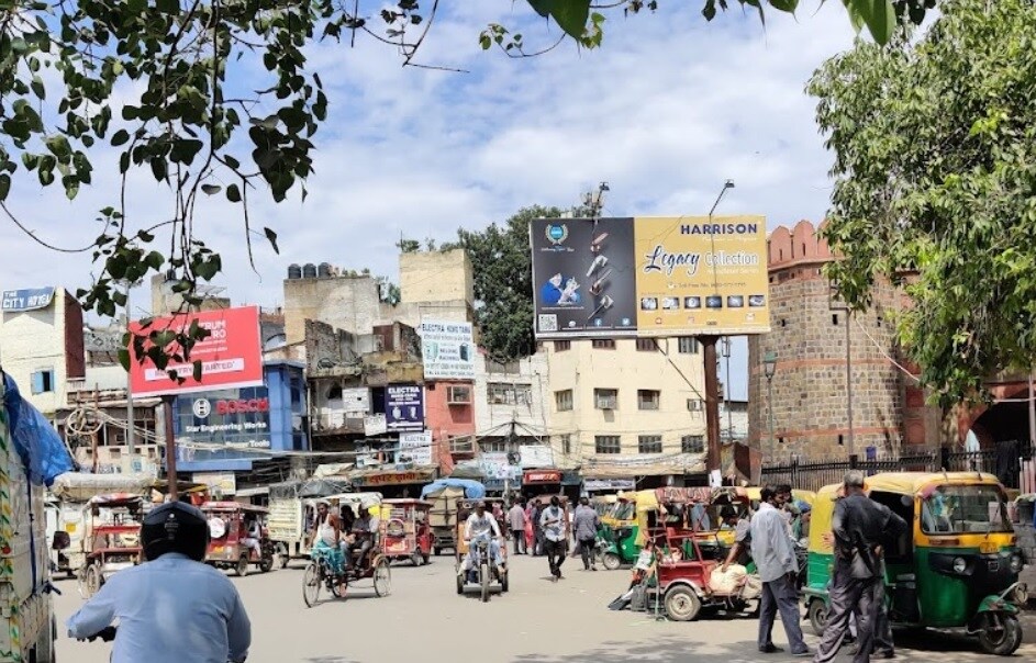 Chawri Bazar_a city street filled with lots of cars and motorcycles