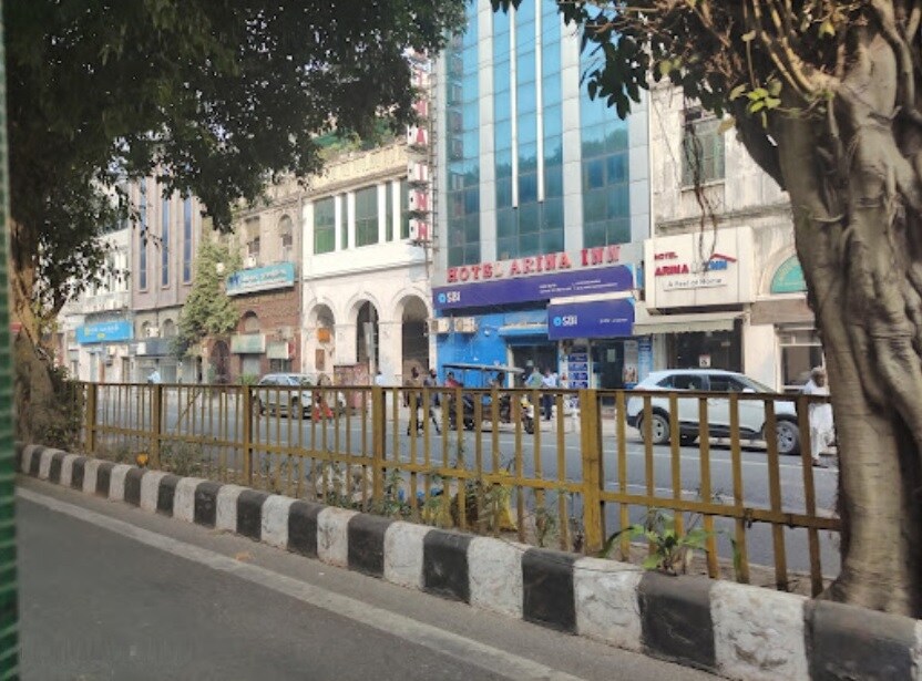 Daryaganj_a city street with a fence and a building