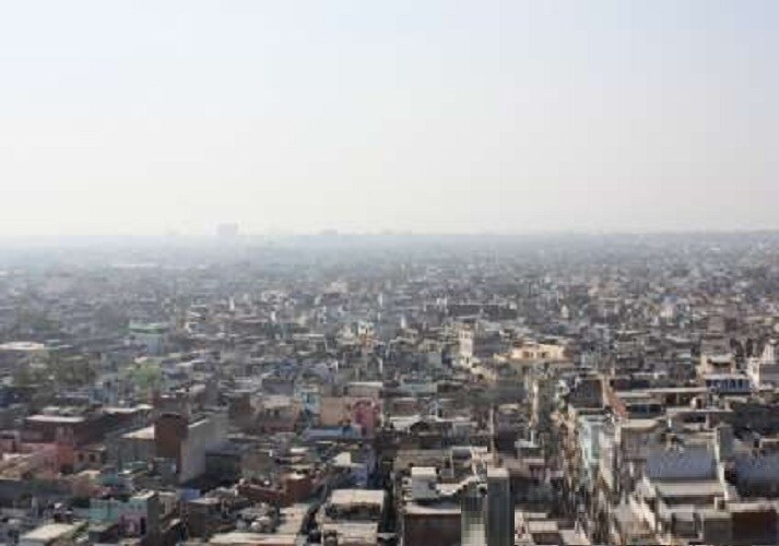 Ganesh Nagar_a city with lots of tall buildings and a sky background