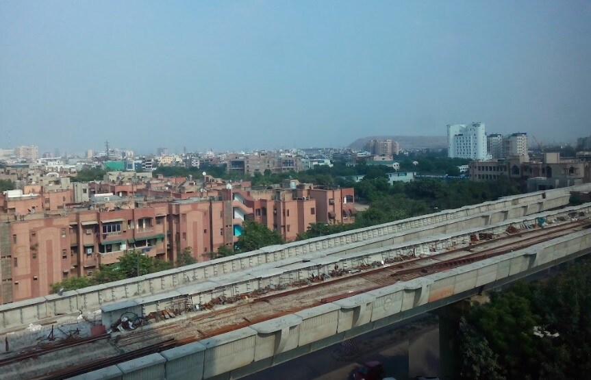 Hasanpur_a large building with a train on top of it