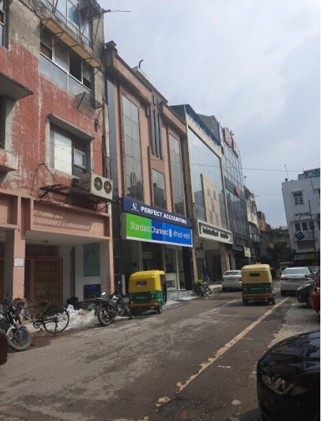 Hauz Khas_a street scene with cars parked on the side of the road