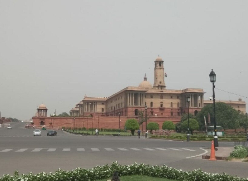Indraprastha_a large building with a clock tower on top of it