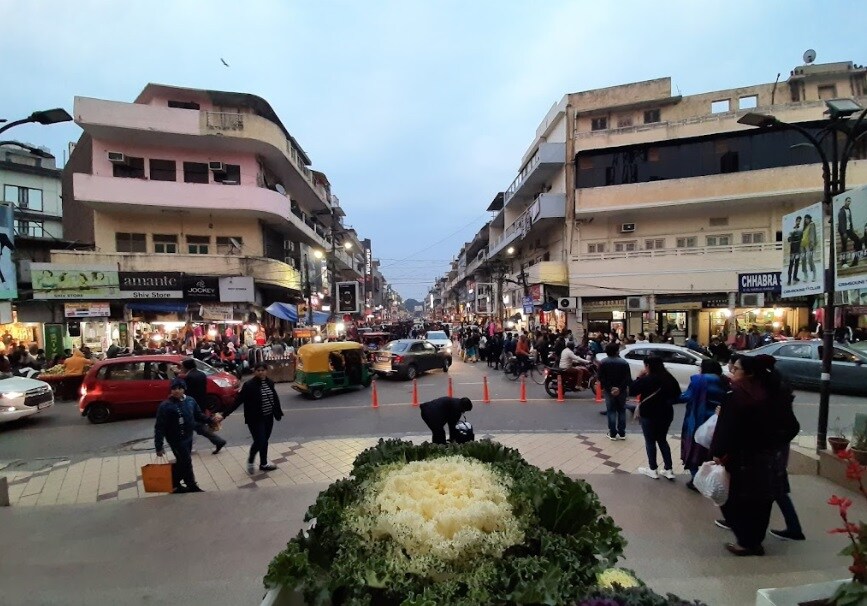 Jawahar Nagar_a city street filled with lots of people walking down it