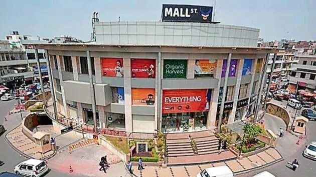 Kamla Nagar_a large building with a sign on the side of it