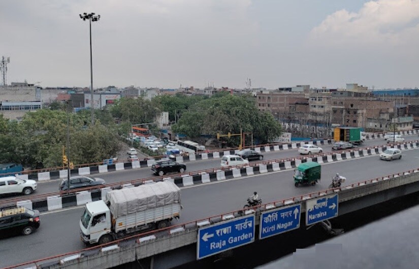 Mayapuri_a highway filled with lots of cars and trucks