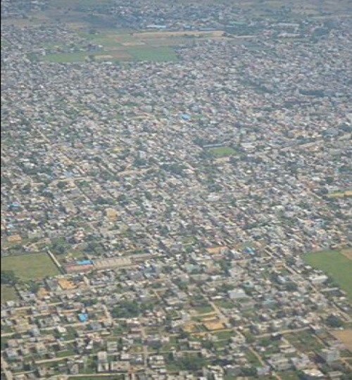 Najafgarh_an aerial view of a city with many tall buildings