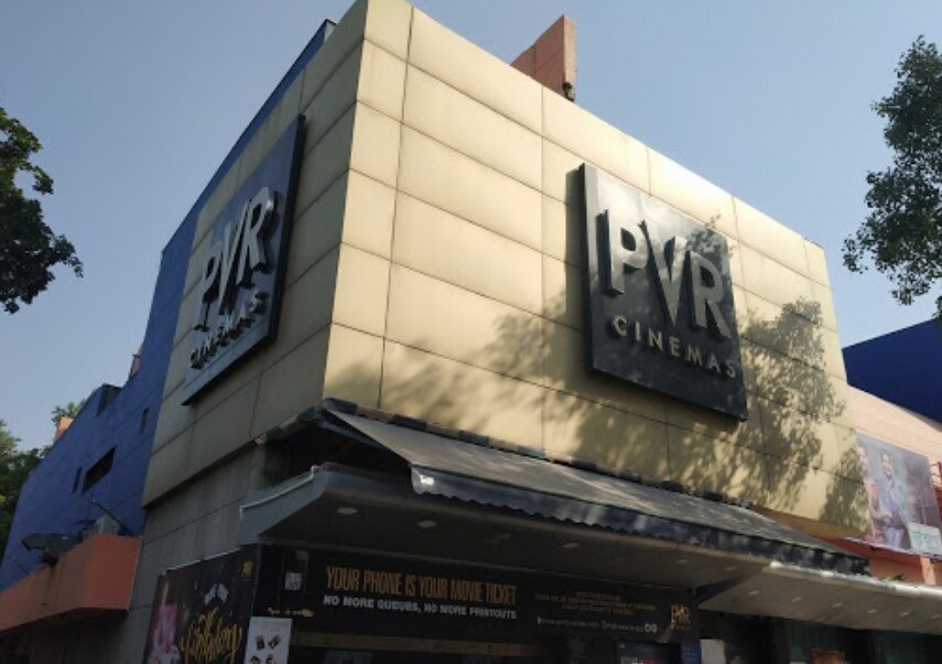 Naraina_a large building with a sign on the side of it