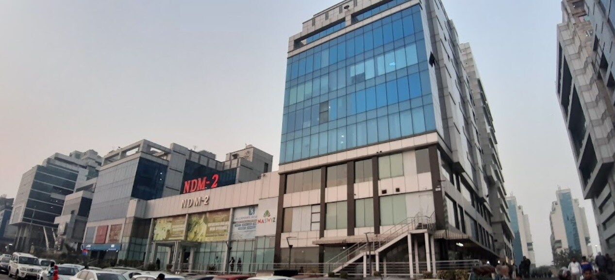 Netaji Subhash Place_a large building with a lot of windows