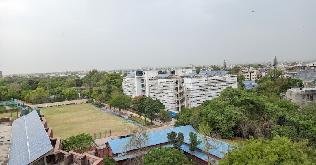 Okhla_a large building with a lot of windows on top of it