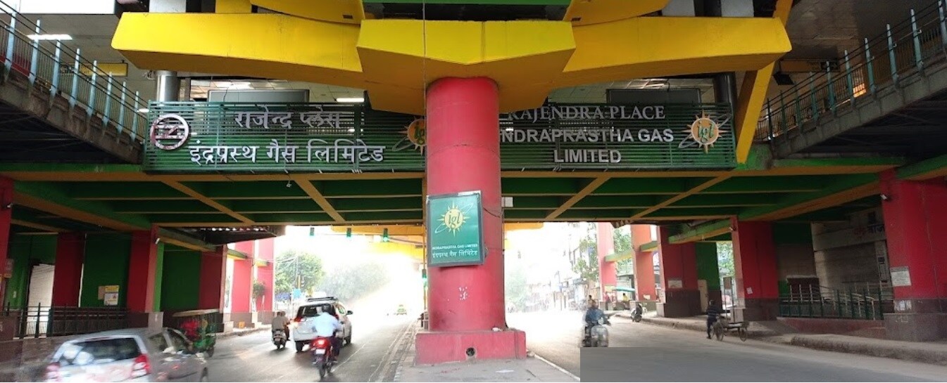 Rajendra Place_a street filled with lots of green and yellow traffic lights