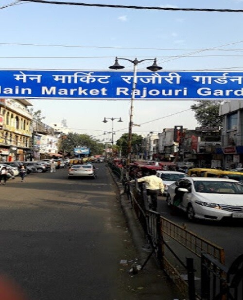 Rajouri Garden_a street sign on the side of a road